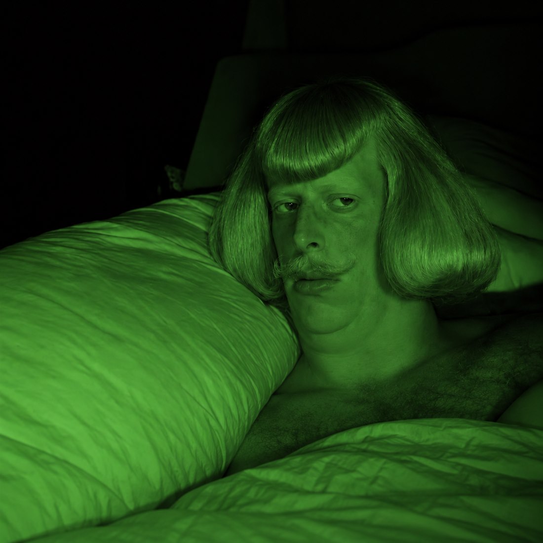 Jean Phil, lit in green